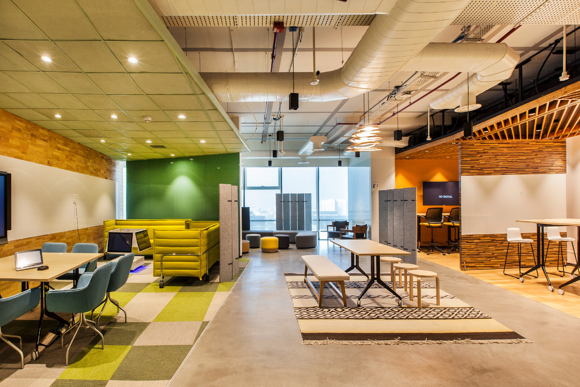 An interior view of Northern Trust's office in Pune with contrasting to assist individuals with disabilities in navigating the space