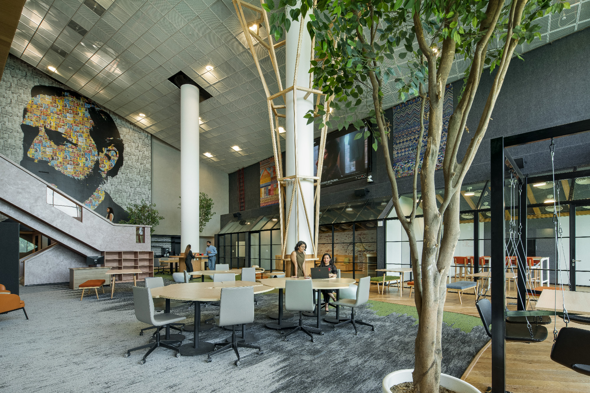 Nestle office interiors promoting biophilia with natural elements and ample sunlight in Gurugram.